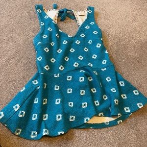 Blue tank top with diamond 💎s and a bow in the back